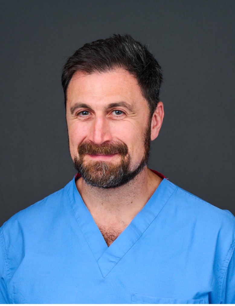 Dr. Fateh Entabi in blue surgical scrubs